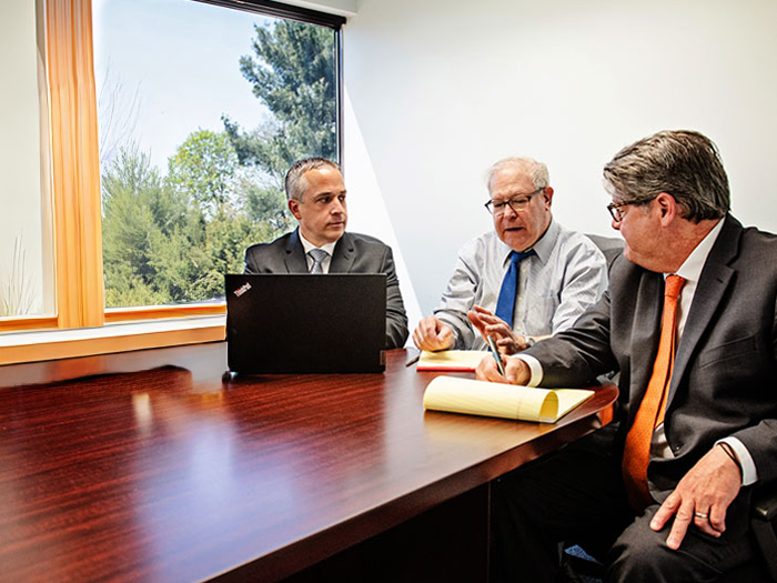 Law Offices of Alan M. Cohen & Associates attorneys meeting with a client